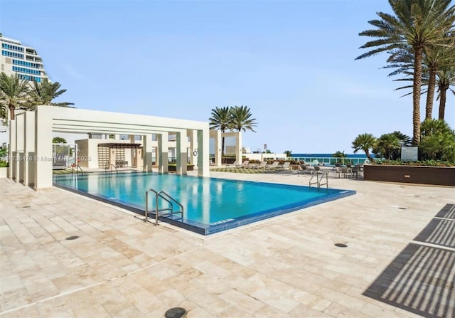 101 S Fort Lauderdale Beach Blvd Unit 308, Fort Lauderdale, FL 33316 - community pool featuring a patio