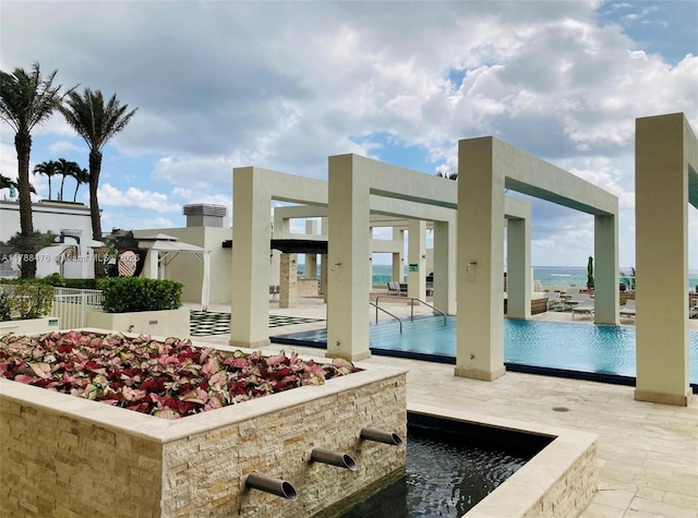 101 S Fort Lauderdale Beach Blvd Unit 308, Fort Lauderdale, FL 33316 - view of patio featuring a community pool