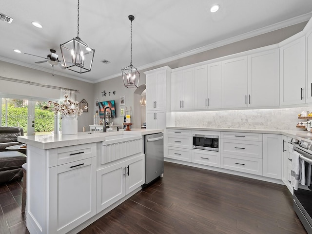 973 NE 36th Ave, Homestead, FL 33033 - kitchen featuring open floor plan, recessed lighting, white cabinetry, tasteful backsplash, and stainless steel appliances