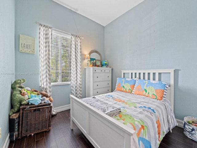 973 NE 36th Ave, Homestead, FL 33033 - bedroom featuring baseboards, vaulted ceiling, and dark wood-type flooring