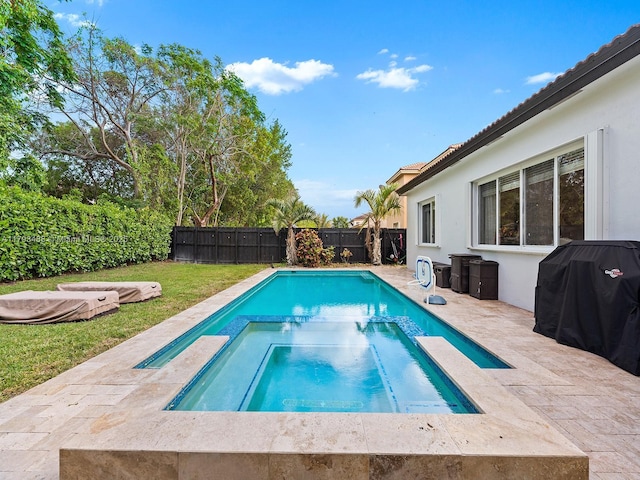 973 NE 36th Ave, Homestead, FL 33033 - view of swimming pool featuring a fenced backyard, a patio area, a pool with connected hot tub, and area for grilling