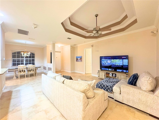 living room featuring crown molding, a raised ceiling, visible vents, and ceiling fan with notable chandelier