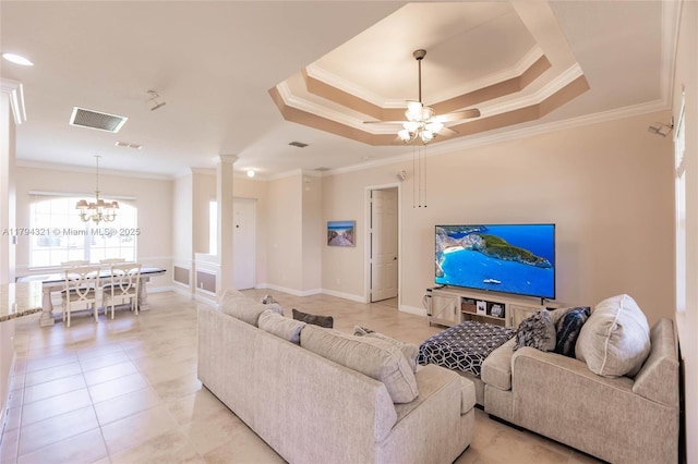 2041 SW Imperial St, Port St Lucie, FL 34987 - living room featuring ornamental molding, ornate columns, ceiling fan, light tile patterned flooring, and a chandelier