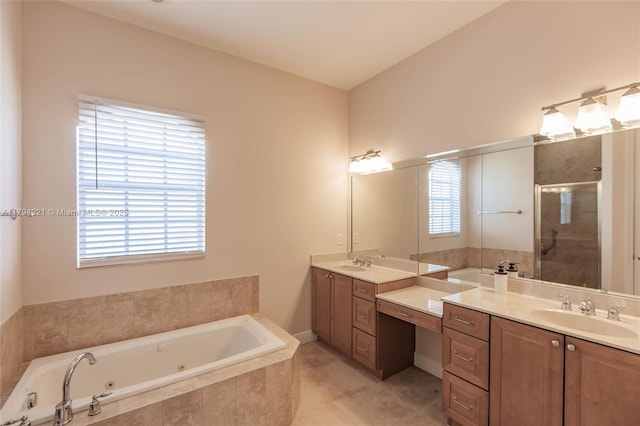 2041 SW Imperial St, Port St Lucie, FL 34987 - full bath featuring a shower stall, a whirlpool tub, two vanities, and tile patterned flooring