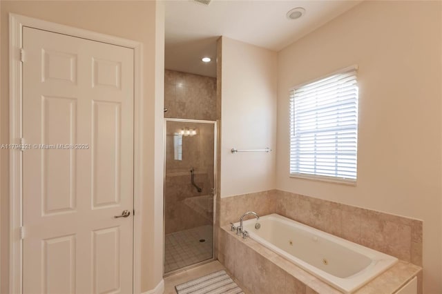 2041 SW Imperial St, Port St Lucie, FL 34987 - bathroom featuring a tub with jets, a shower stall, plenty of natural light, and recessed lighting