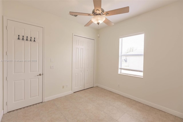2041 SW Imperial St, Port St Lucie, FL 34987 - unfurnished bedroom featuring baseboards, a closet, and a ceiling fan