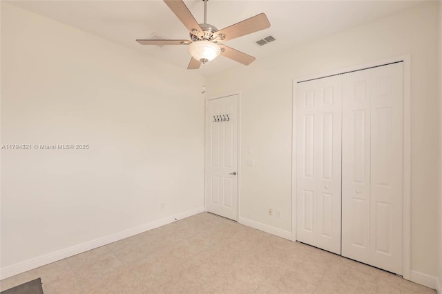 2041 SW Imperial St, Port St Lucie, FL 34987 - unfurnished bedroom with baseboards, a closet, and ceiling fan