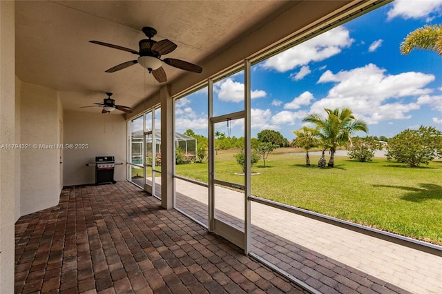 2041 SW Imperial St, Port St Lucie, FL 34987 - unfurnished sunroom featuring ceiling fan