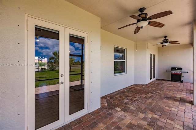 2041 SW Imperial St, Port St Lucie, FL 34987 - view of patio / terrace with french doors and a ceiling fan