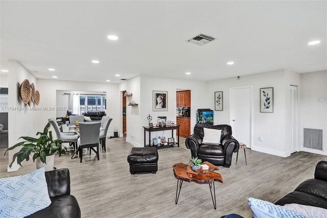 kitchen featuring white appliances, backsplash, a sink, and a toaster