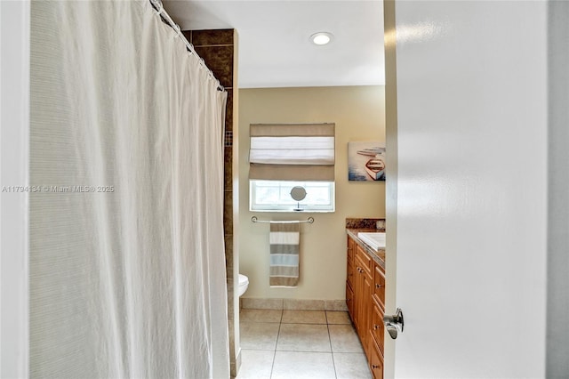 bathroom with toilet, tile patterned floors, a shower with shower curtain, and vanity