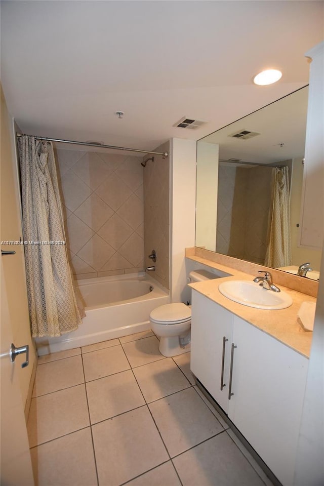 full bathroom with shower / bath combo with shower curtain, tile patterned floors, visible vents, and toilet