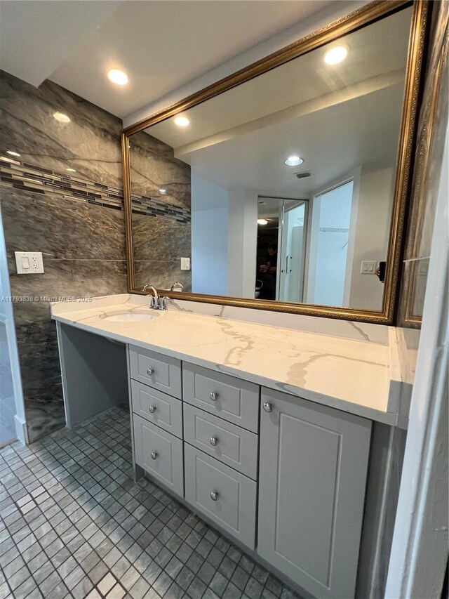 bathroom featuring vanity and recessed lighting