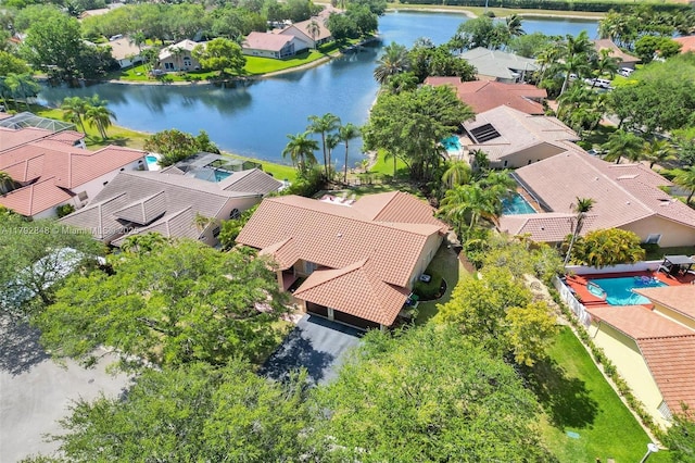 birds eye view of property featuring a water view and a residential view