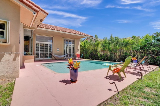 view of pool featuring a fenced in pool, fence, and a patio area