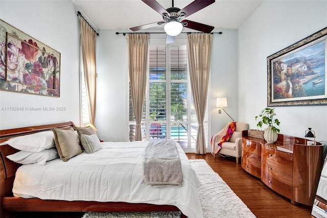 bedroom featuring a ceiling fan and wood finished floors