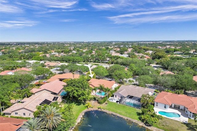 drone / aerial view with a residential view and a water view