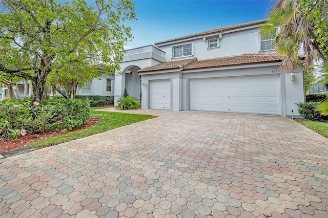4123 W Lake Estates Dr, Davie, FL 33328 - mediterranean / spanish home with decorative driveway, stucco siding, and a tile roof