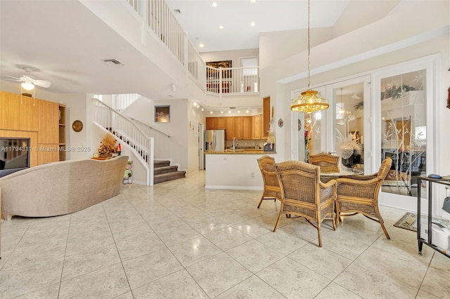 4123 W Lake Estates Dr, Davie, FL 33328 - dining room featuring stairway, ceiling fan, a high ceiling, and light tile patterned floors