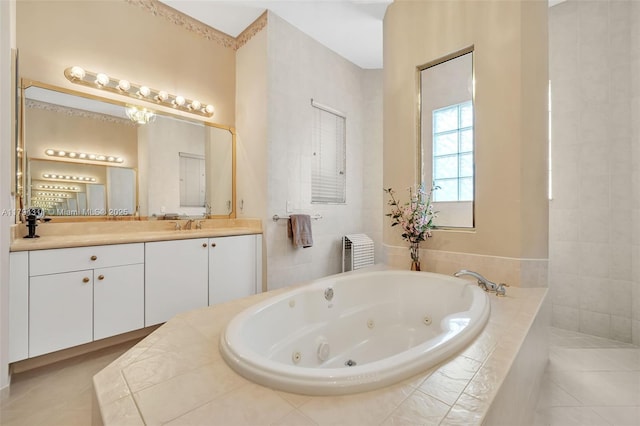 4123 W Lake Estates Dr, Davie, FL 33328 - bathroom featuring a jetted tub, vanity, and tile patterned floors