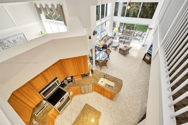 4123 W Lake Estates Dr, Davie, FL 33328 - living area featuring healthy amount of natural light, light tile patterned floors, a high ceiling, and ceiling fan