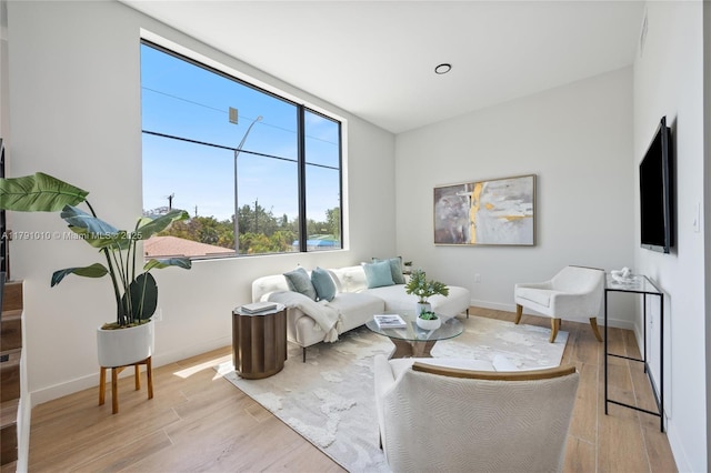 living room with light wood-style floors and baseboards