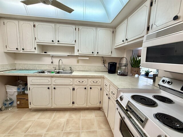2301 NE 14th St Cswy Unit 201E, Pompano Beach, FL 33062 - kitchen featuring ceiling fan, open shelves, a sink, light countertops, and white appliances