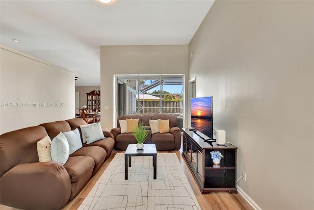 7649 Briar Cliff Cir, Lake Worth, FL 33467 - living area featuring light wood-style floors and baseboards