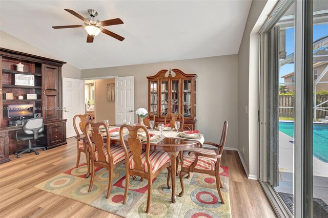 7649 Briar Cliff Cir, Lake Worth, FL 33467 - dining room with light wood-type flooring, a ceiling fan, lofted ceiling, an office area, and baseboards