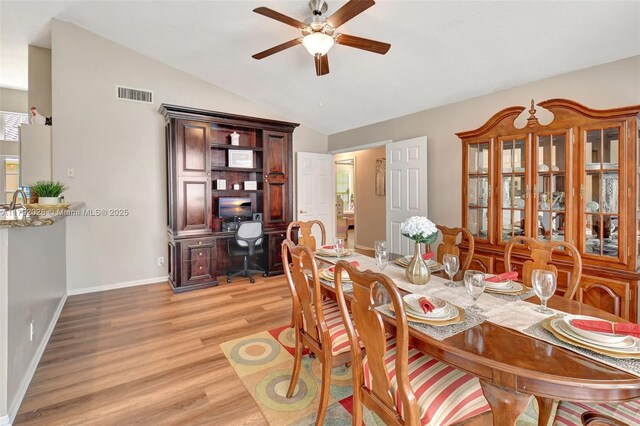 7649 Briar Cliff Cir, Lake Worth, FL 33467 - dining area with a ceiling fan, light wood-style flooring, lofted ceiling, an office area, and baseboards
