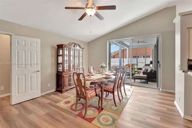 7649 Briar Cliff Cir, Lake Worth, FL 33467 - dining space with a ceiling fan, vaulted ceiling, light wood finished floors, and baseboards