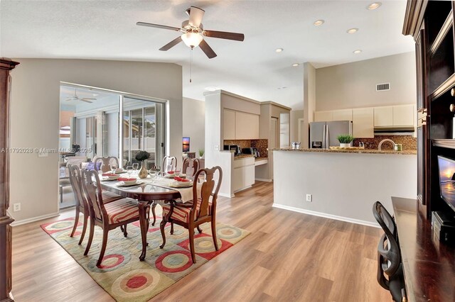 7649 Briar Cliff Cir, Lake Worth, FL 33467 - dining room featuring ceiling fan, light wood-style flooring, high vaulted ceiling, and recessed lighting