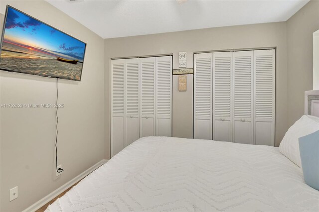 7649 Briar Cliff Cir, Lake Worth, FL 33467 - bedroom with two closets and baseboards