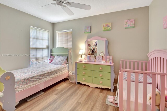 7649 Briar Cliff Cir, Lake Worth, FL 33467 - bedroom with light wood-type flooring and ceiling fan