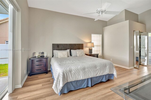 7649 Briar Cliff Cir, Lake Worth, FL 33467 - bedroom featuring light wood-style flooring, vaulted ceiling, baseboards, and a ceiling fan