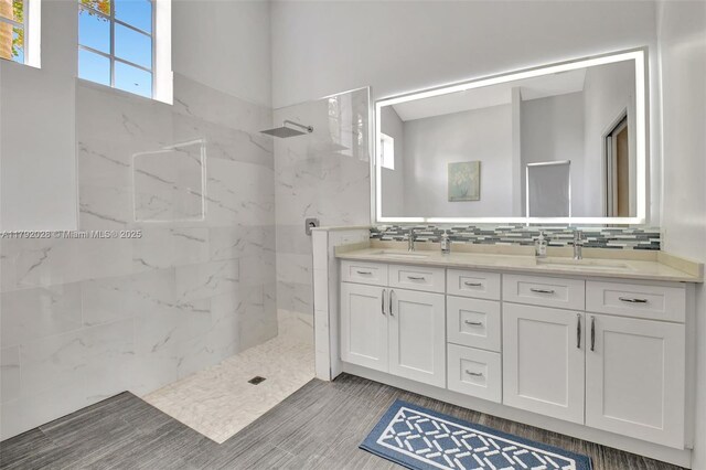 7649 Briar Cliff Cir, Lake Worth, FL 33467 - full bathroom featuring a marble finish shower, healthy amount of natural light, double vanity, and decorative backsplash