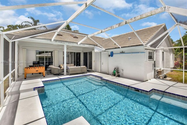 7649 Briar Cliff Cir, Lake Worth, FL 33467 - rear view of property featuring an outdoor hangout area, a tile roof, a patio area, and an outdoor pool