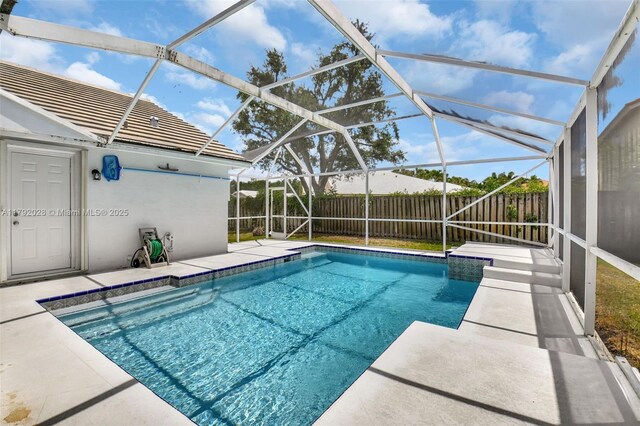 7649 Briar Cliff Cir, Lake Worth, FL 33467 - view of pool featuring a fenced backyard, glass enclosure, and a patio area