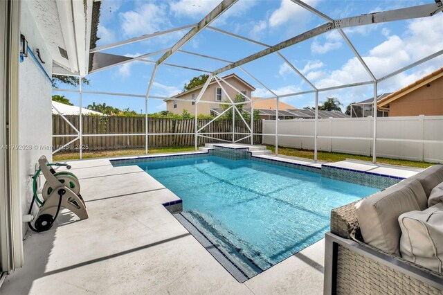 7649 Briar Cliff Cir, Lake Worth, FL 33467 - view of swimming pool with a patio area, a fenced backyard, and a lanai