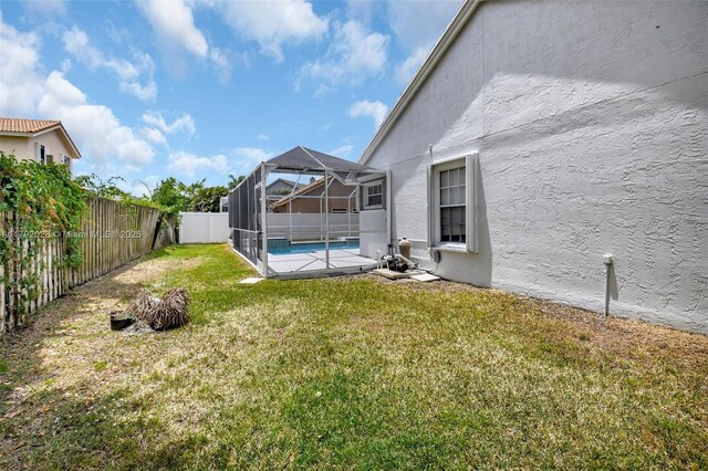 7649 Briar Cliff Cir, Lake Worth, FL 33467 - view of yard featuring glass enclosure