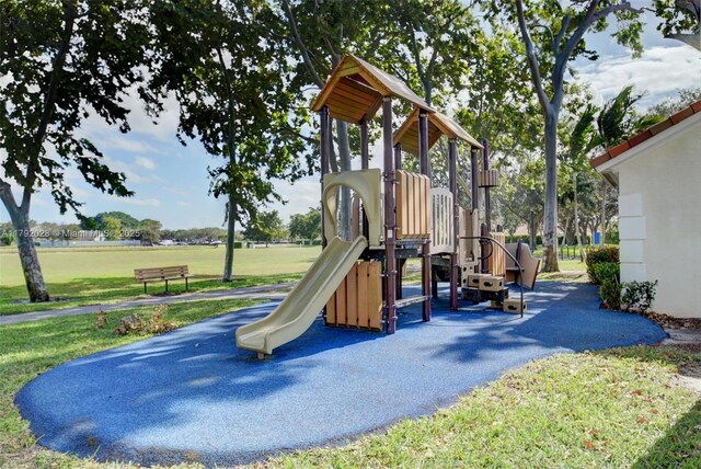 7649 Briar Cliff Cir, Lake Worth, FL 33467 - community jungle gym featuring a lawn