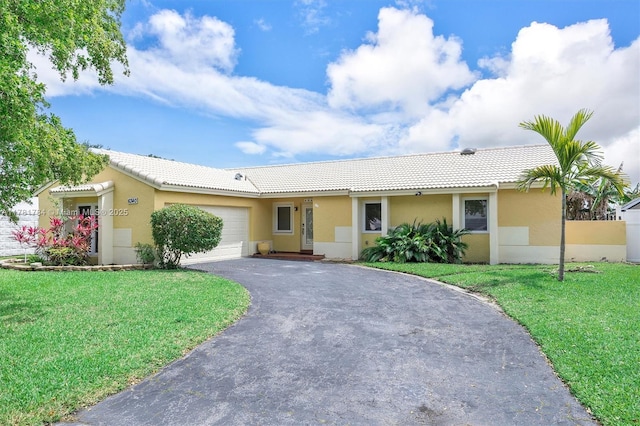 6340 NW 198th Ter, Hialeah, FL 33015 - ranch-style home with a tiled roof, an attached garage, stucco siding, and aphalt driveway