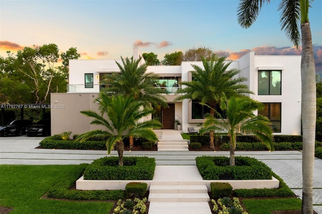 contemporary home featuring stucco siding