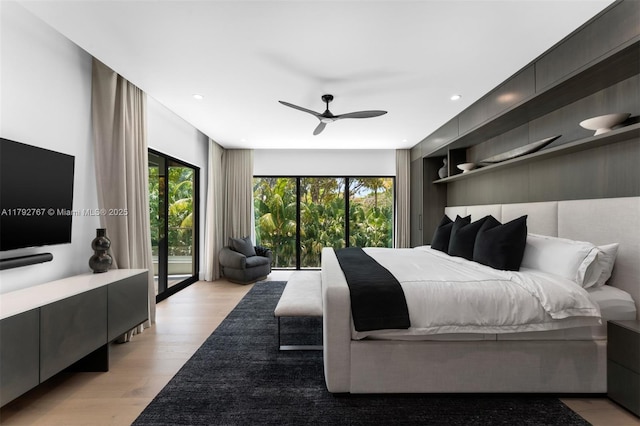bedroom with recessed lighting, multiple windows, a ceiling fan, and light wood finished floors