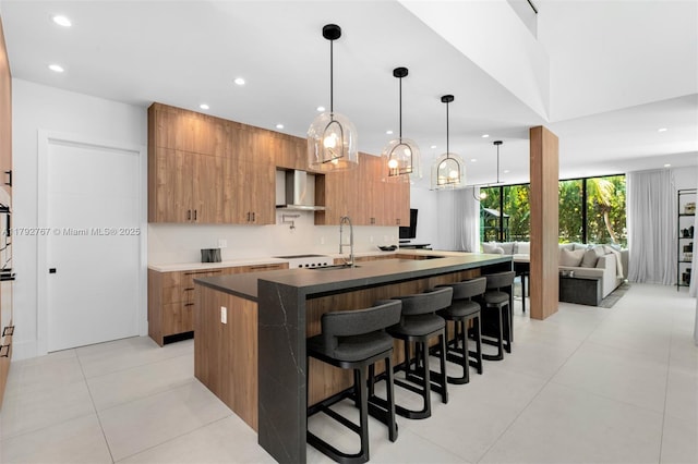 kitchen with recessed lighting, modern cabinets, and wall chimney exhaust hood