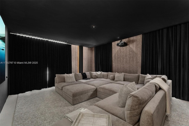 home theater with carpet floors and wallpapered walls