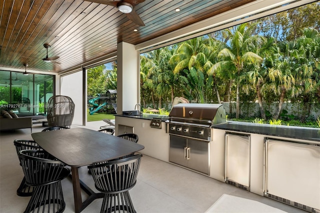 view of patio / terrace featuring outdoor dining area, ceiling fan, and area for grilling