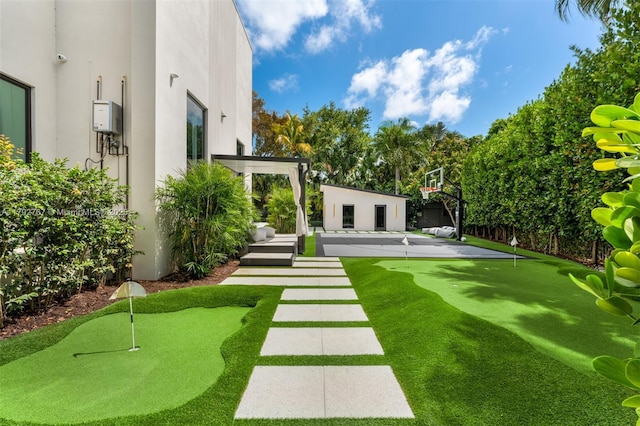 13180 Old Cutler Rd, Pinecrest, FL 33156 - view of yard with a putting green and an outbuilding