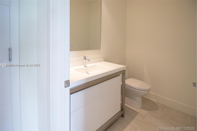 2000 Metropica Way Unit 615, Sunrise, FL 33323 - bathroom featuring vanity, toilet, and baseboards
