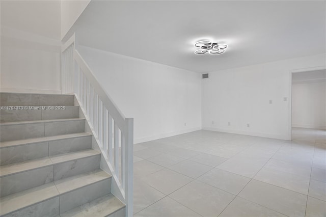 853 SW 118th Ter, Davie, FL 33325 - staircase featuring tile patterned floors, baseboards, and visible vents
